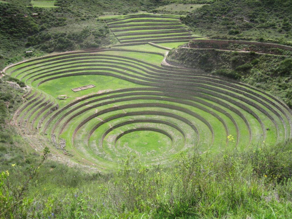 A large circular structure in the middle of a field